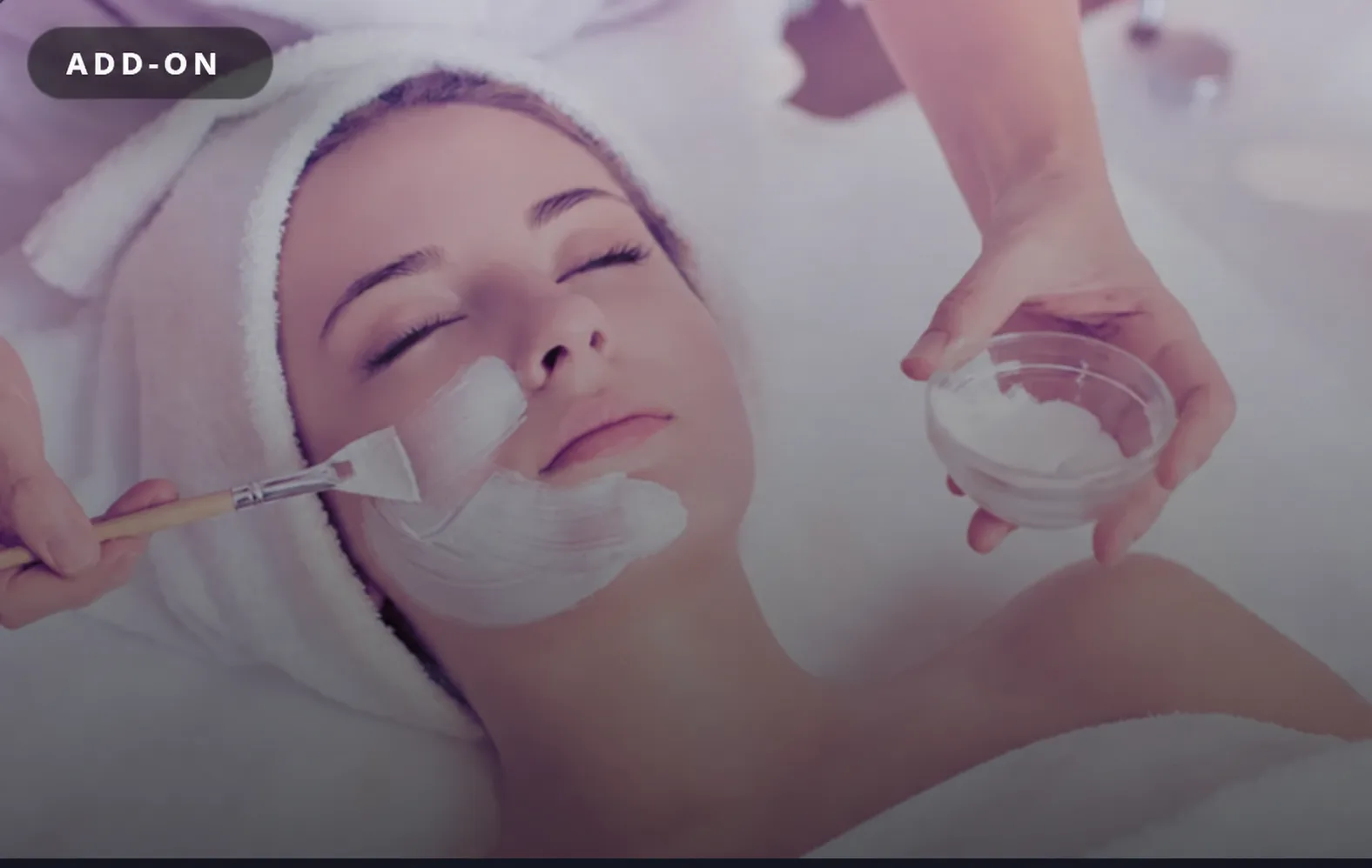 A facial mask applied with a soft brush